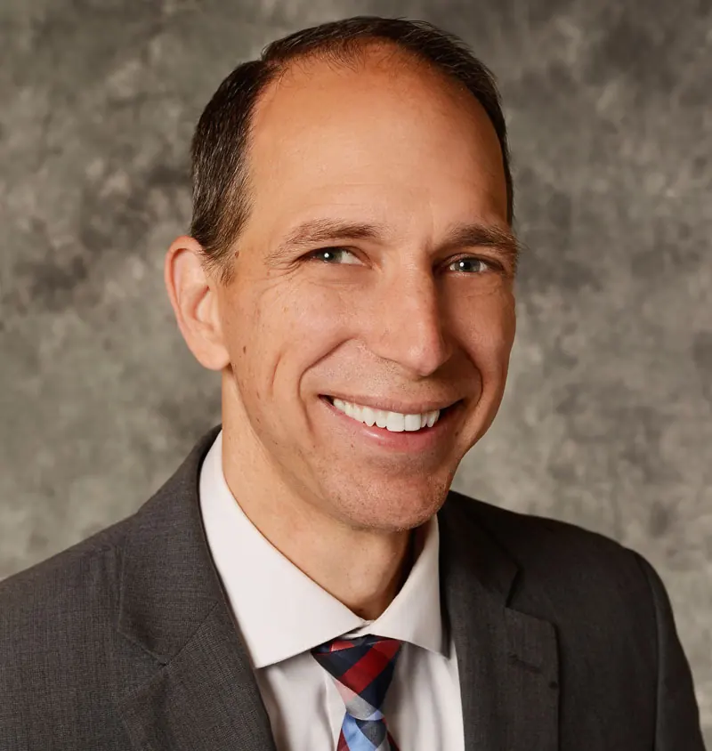 Professional image of Dr. Gailey in a suit and tie.